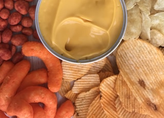 bowl of gravy beside crackers