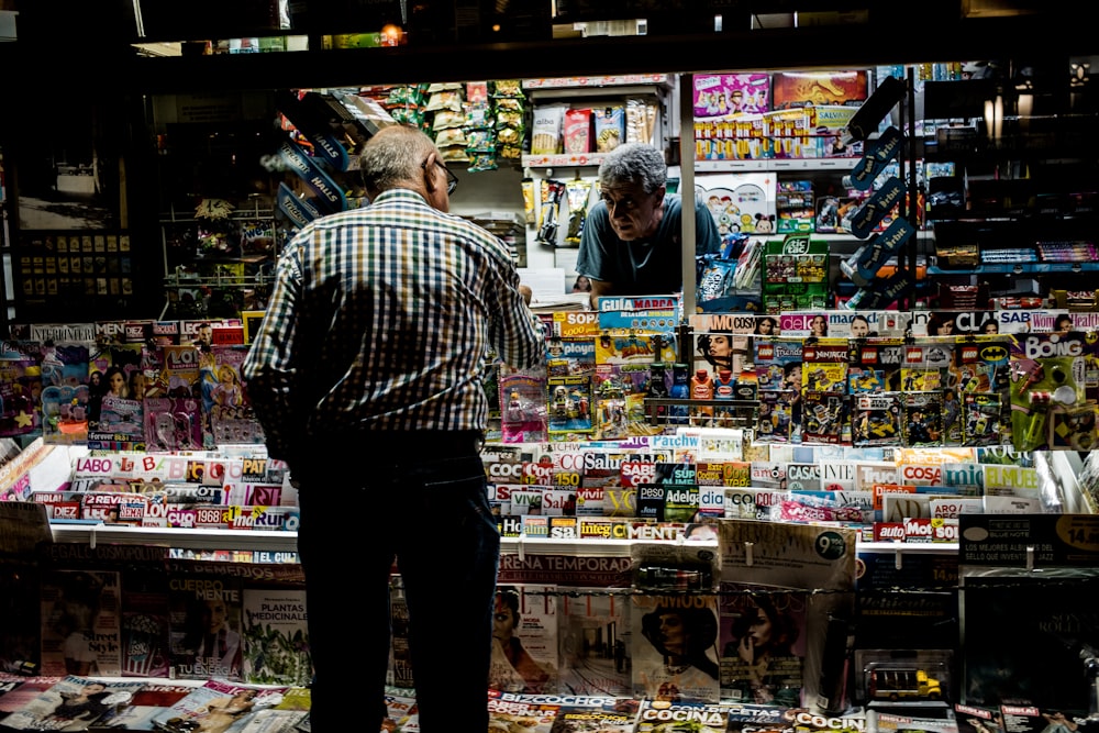 man standing in front of the stall