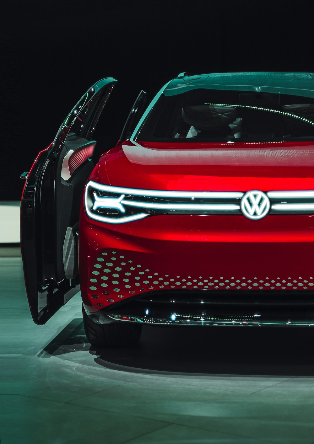 open door of red Volkswagen car