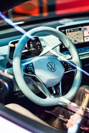 white Volkswagen multi-function steering wheel