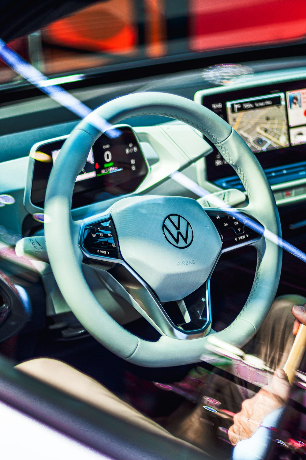 white Volkswagen multi-function steering wheel