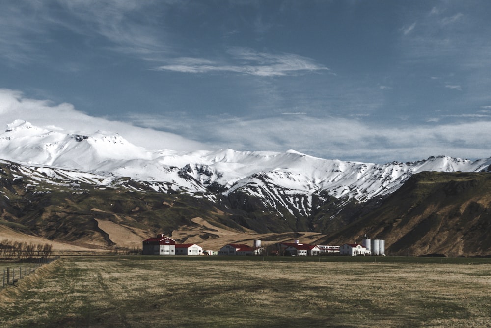 white and brown house near mountain