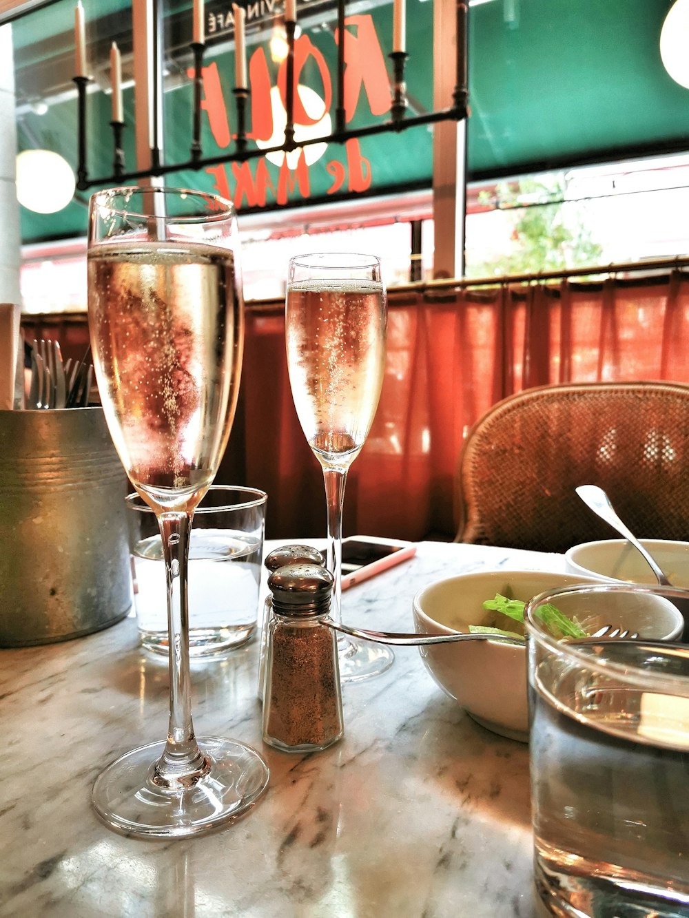 clear glass goblets on table