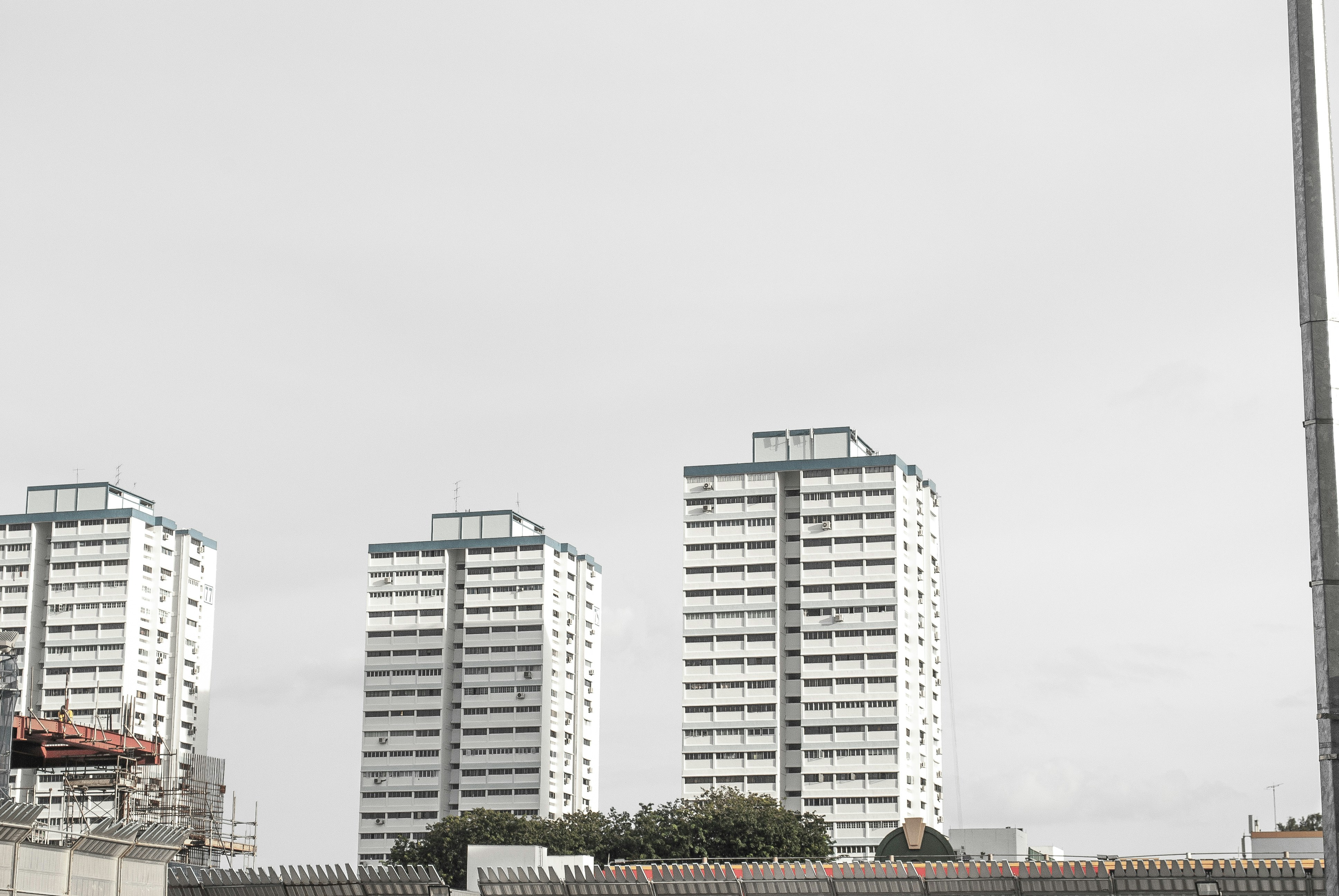 A close-up shot of a legal property deed or document with a pen, implying official processing and regulation.