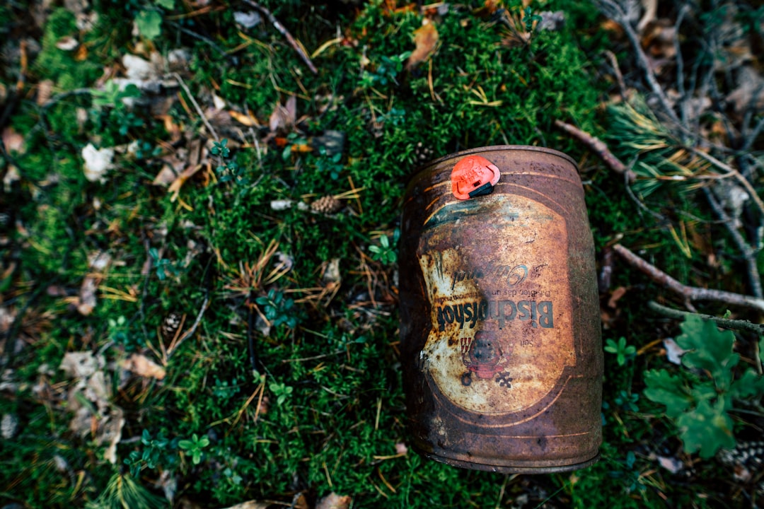 two brown and green metal containers