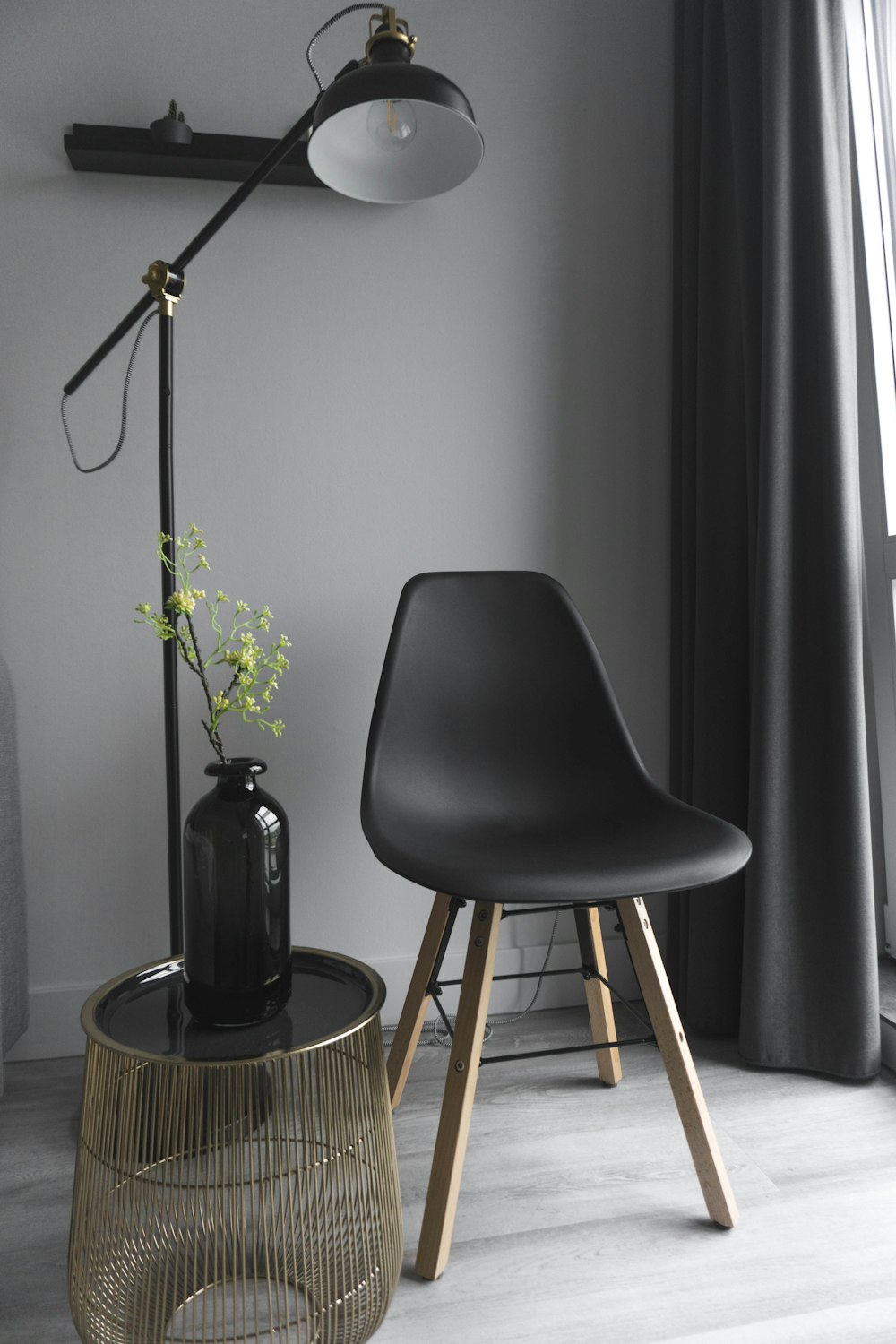 empty chair beside floor lamp