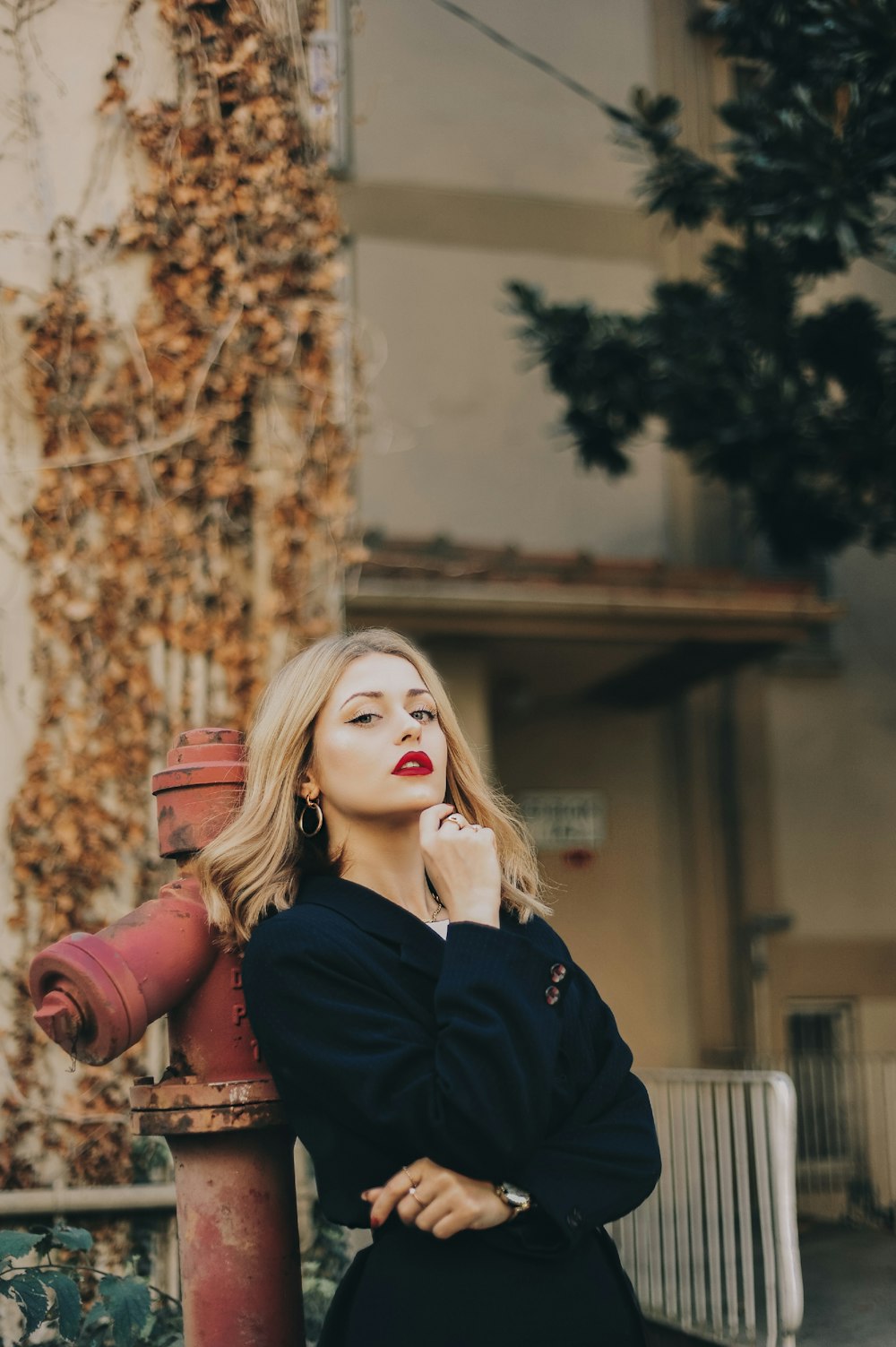 woman leaning on pipe