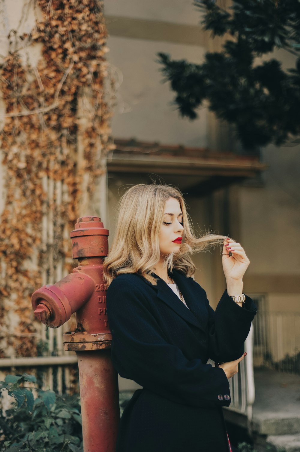 woman leaning on hydrant