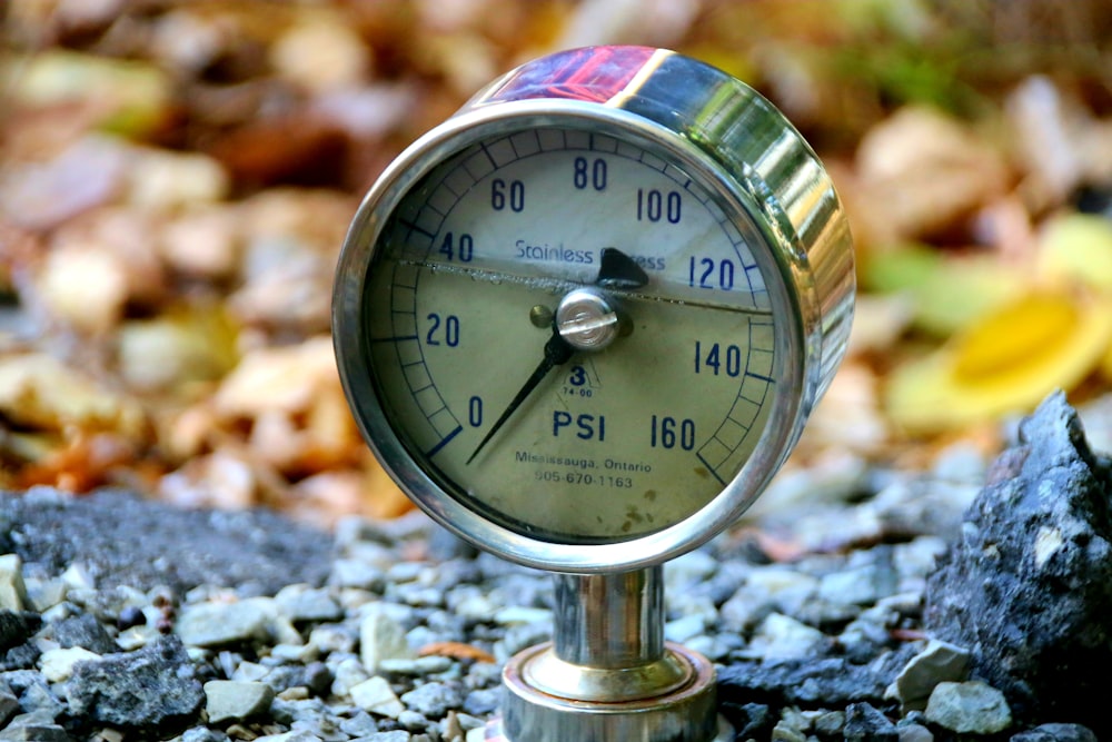 a close up of a thermometer on the ground