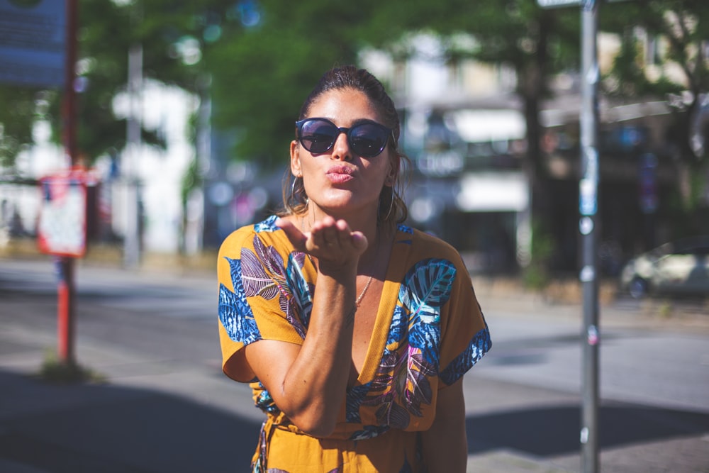 woman blowing kiss