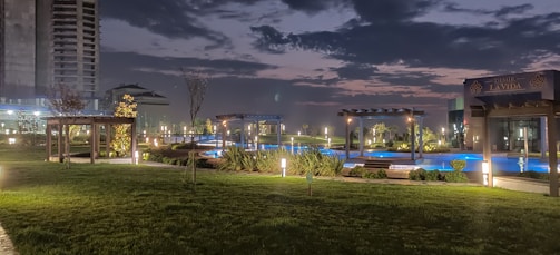 Nighttime view of a gated community with security patrols.