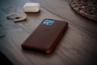 shallow focus photo of iPhone 11 Pro with black case