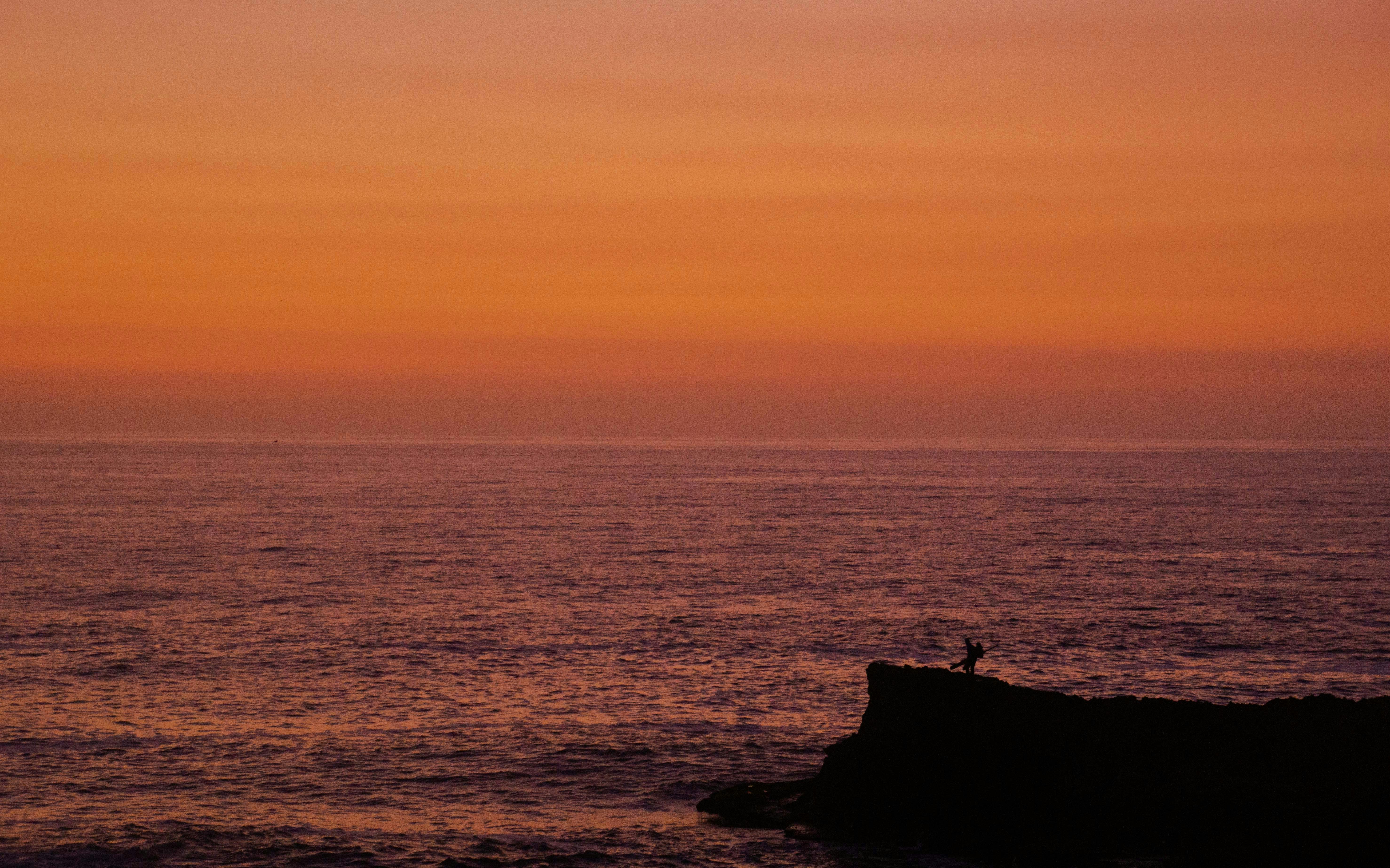 body of water during golden hour