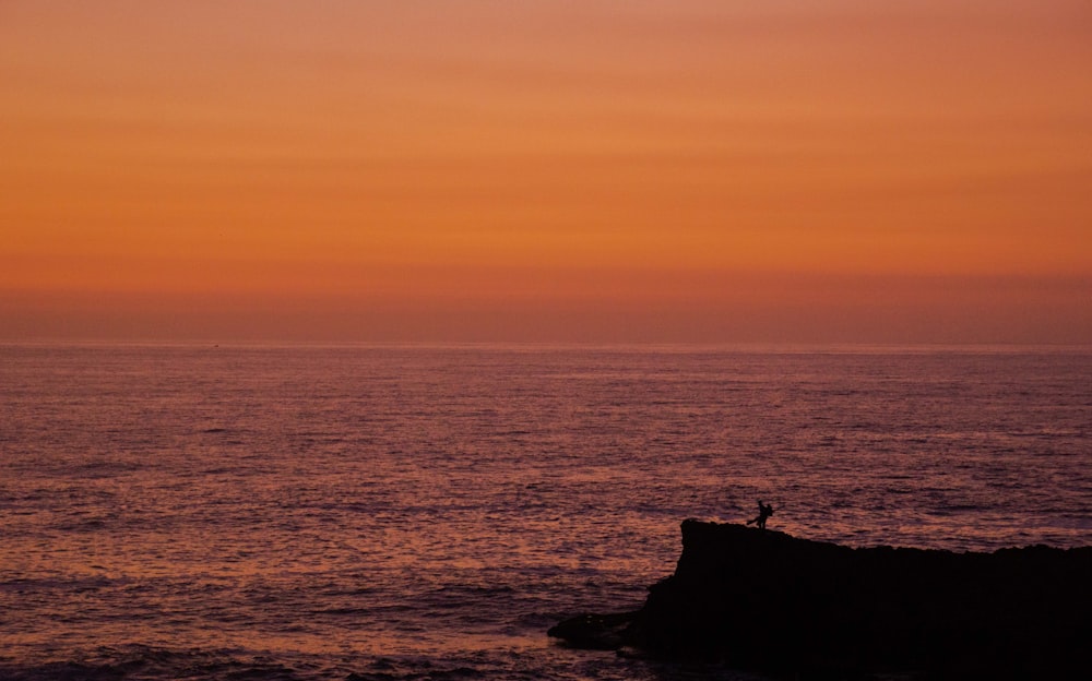 body of water during golden hour