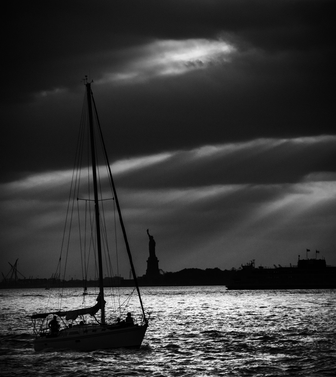 silhouette of sailboat in ocean