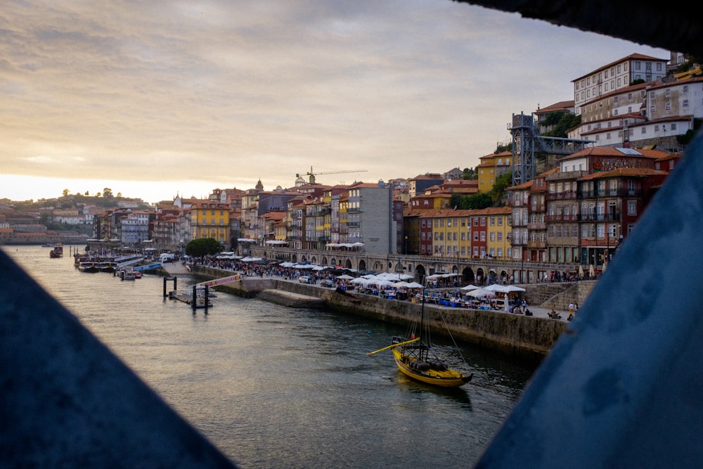 gray and multicolored concrete buildings near body of water