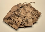 A set of gift tags adorned with elegant scripture verses and warm designs.