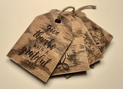 A set of gift tags adorned with elegant scripture verses and warm designs.