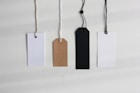 four paper card tags