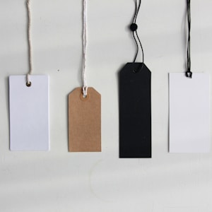 four paper card tags