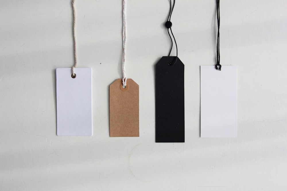 four paper card tags