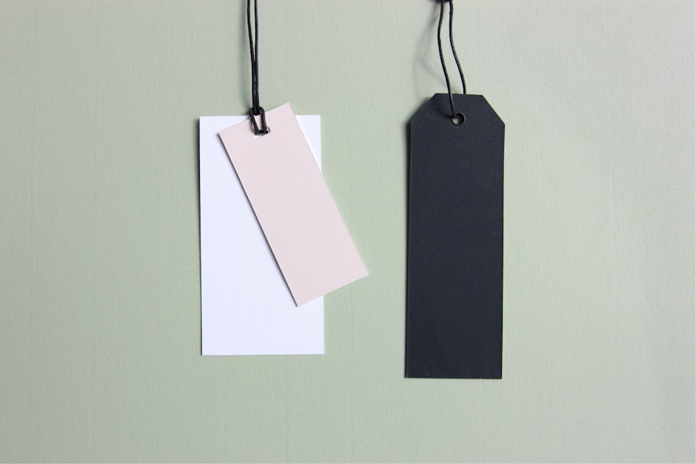 three assorted-color tags