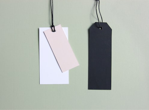 three assorted-color tags