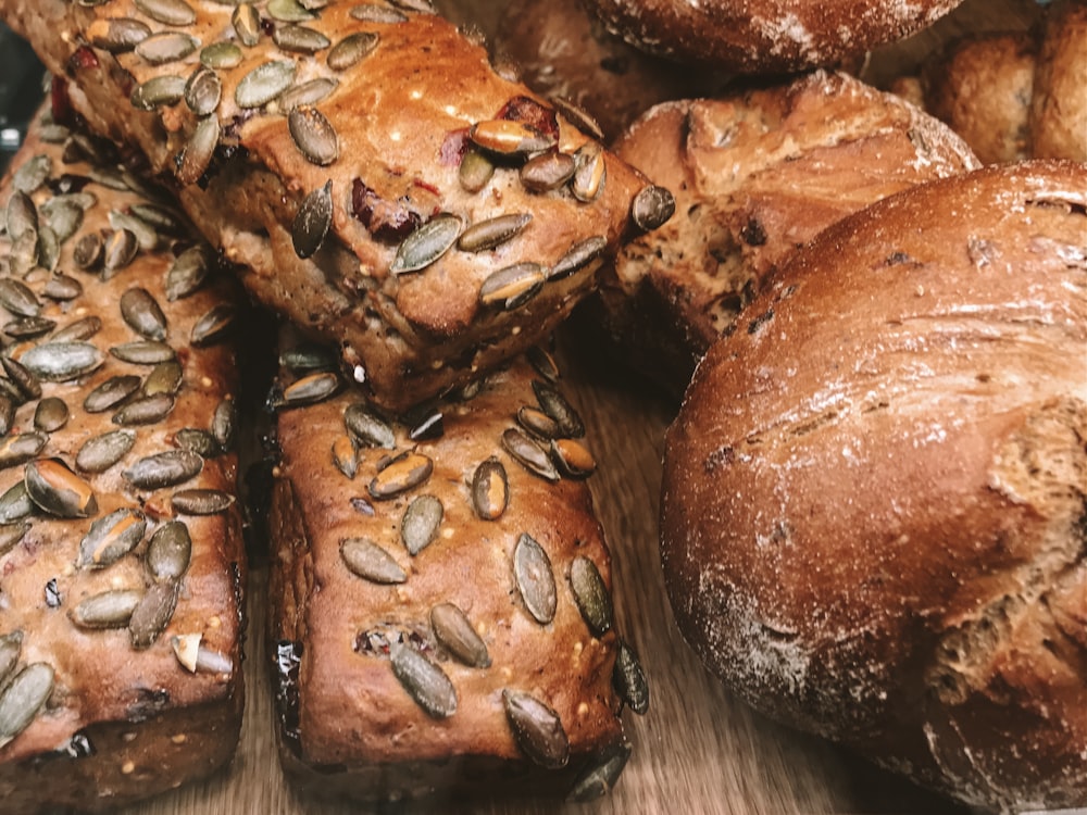 breads on brown wooden surface