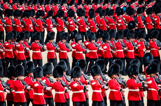 men in red uniform playing instrument