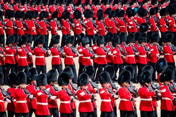 men in red uniform playing instrument