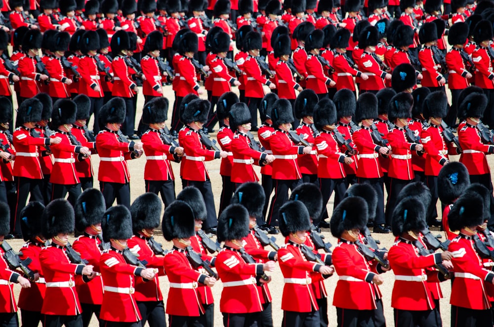 men in red uniform playing instrument