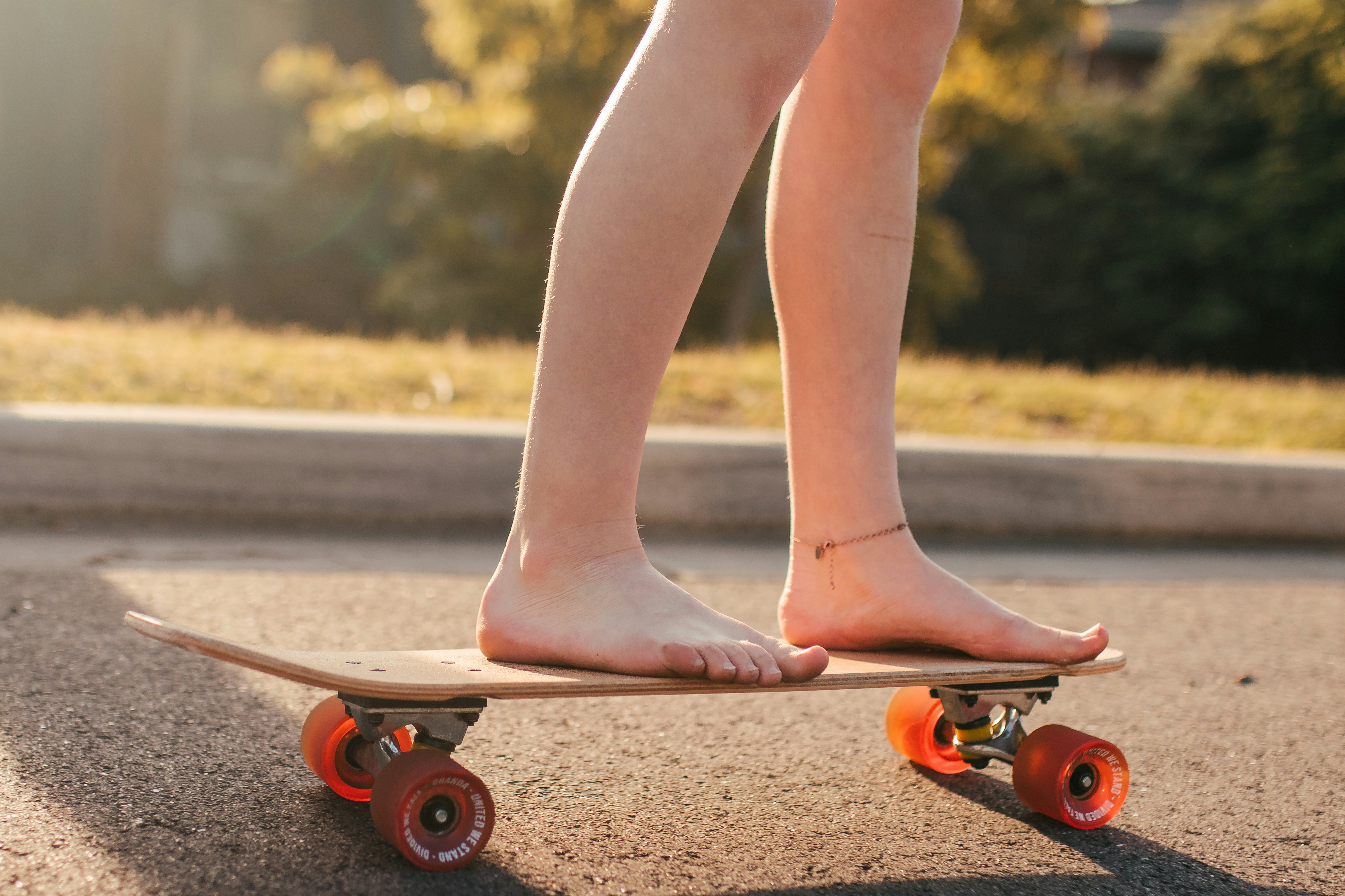 person standing on skateboard during daytime