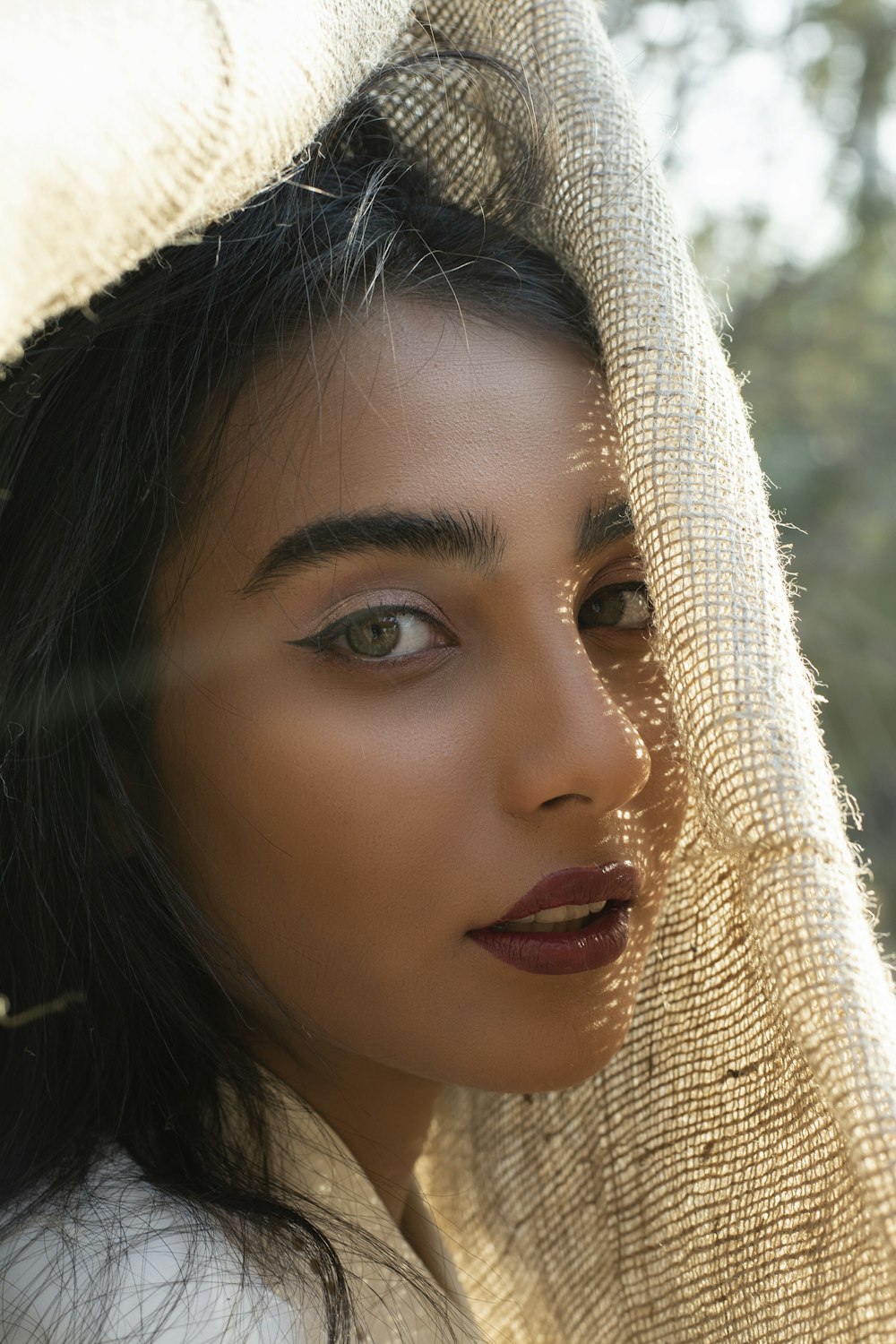 woman wearing maroon lipstick