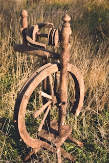 brown wooden spinning wheel