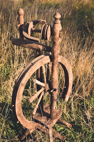 brown wooden spinning wheel