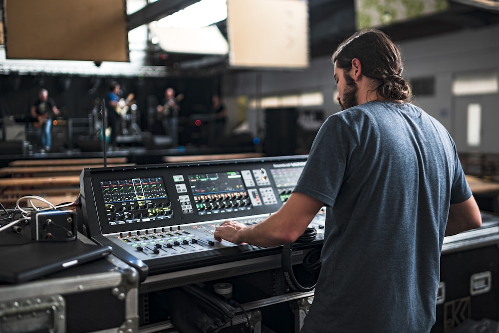 man playing DJ mixer