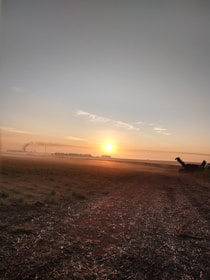 A serene sunrise breaking through mist over an open highway, inviting reflection and hope.