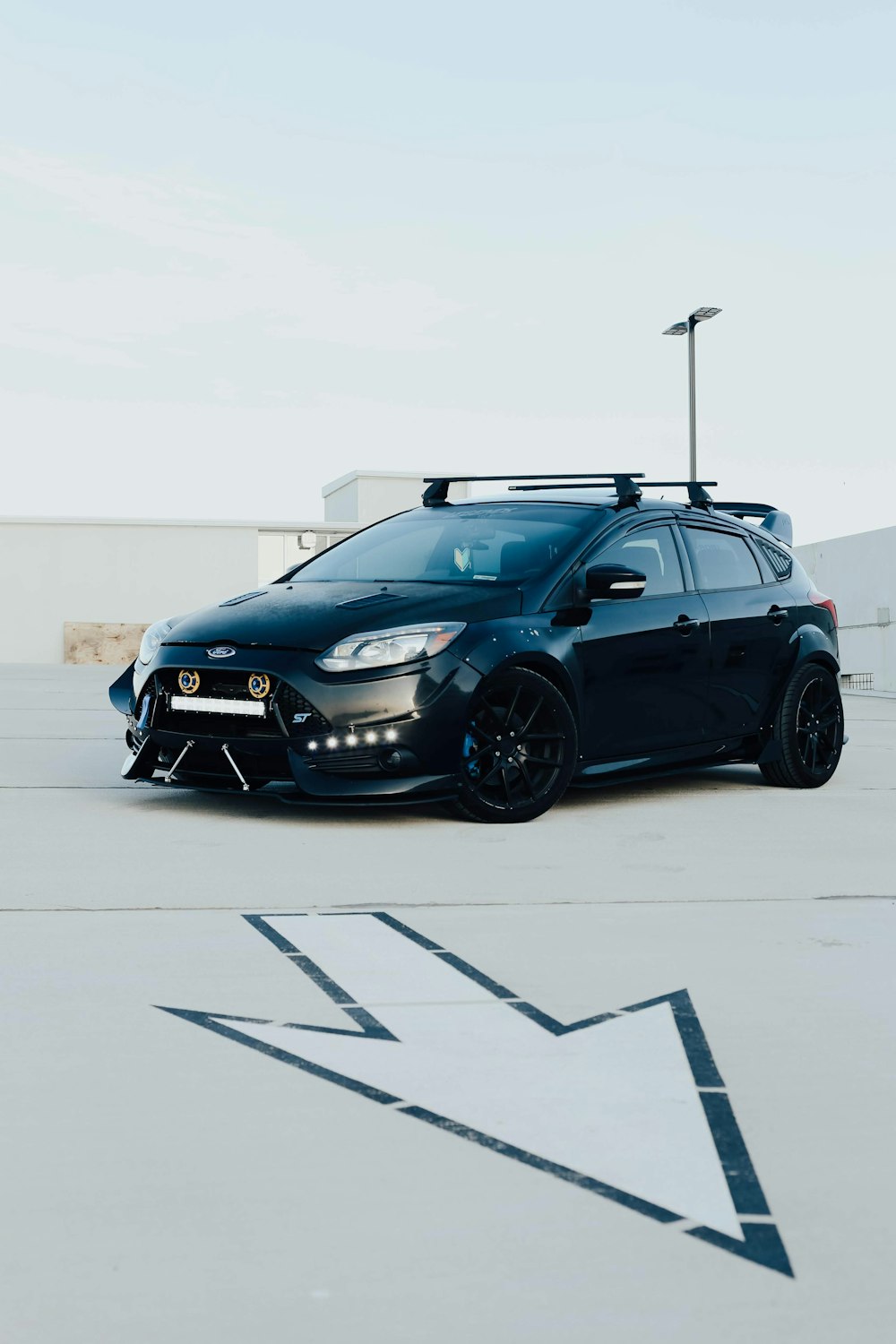 black 5-door hatchback park during daytime