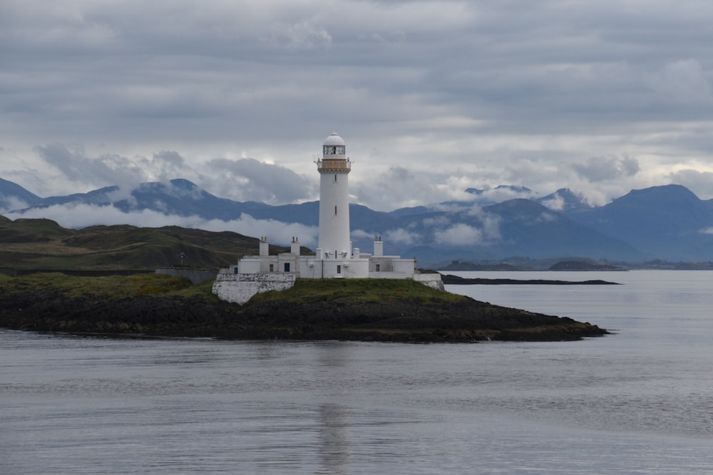 white lighthouse near body of water