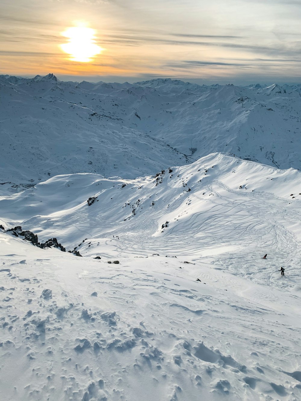 mountain covered by snow under white sky\