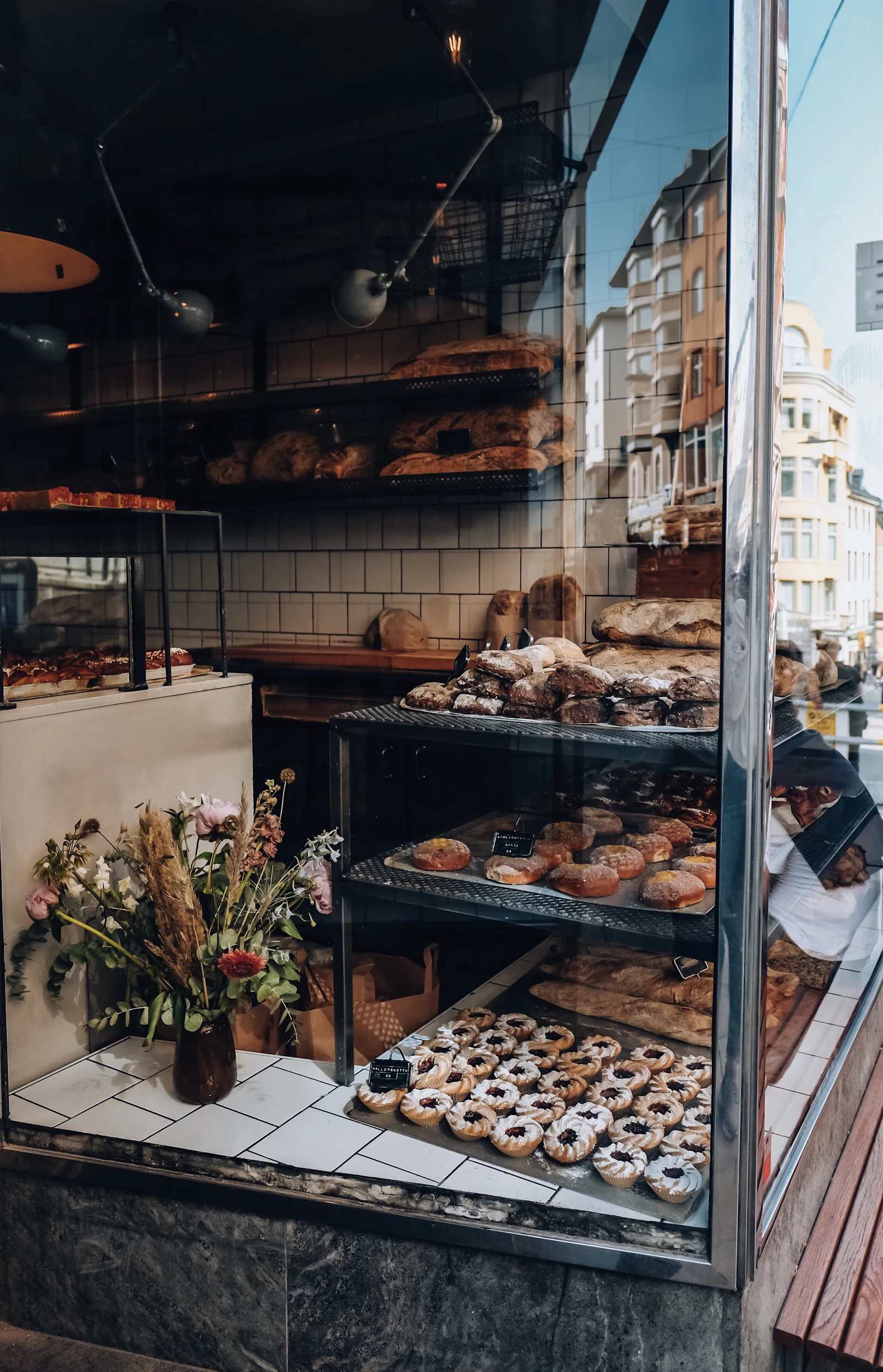 Warm, sunlit interior of a small-town bakery with fresh bread on display