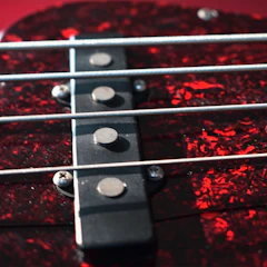Close-up of a guitar with a magnetic pickguard being easily attached.