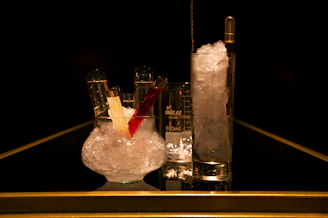 A vibrant chemistry lab kit with colorful test tubes and safety goggles on a sleek dark background.