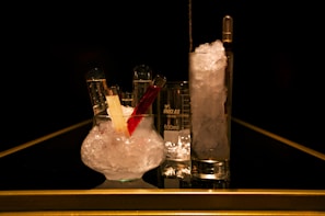 A beautifully arranged setup of drinks with laboratory equipment.
