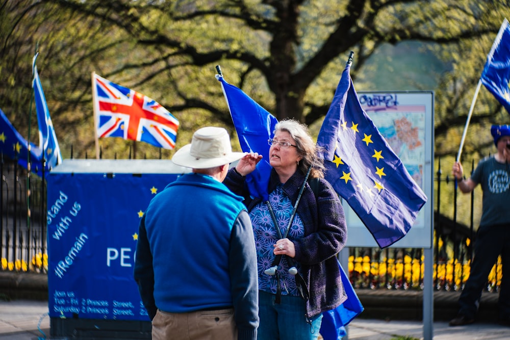 woman holding blue flag