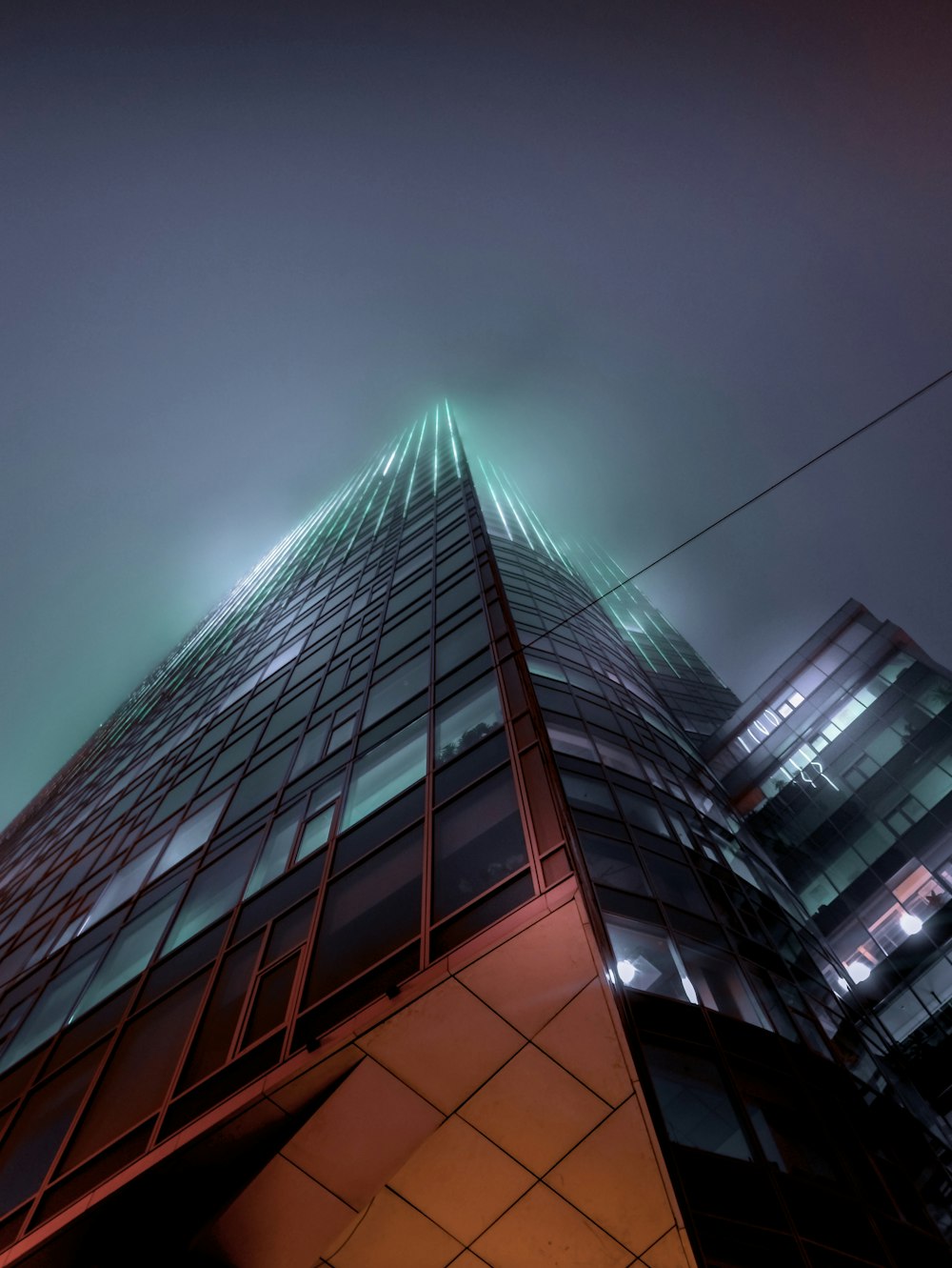 low-angle photography of lighted mirror building