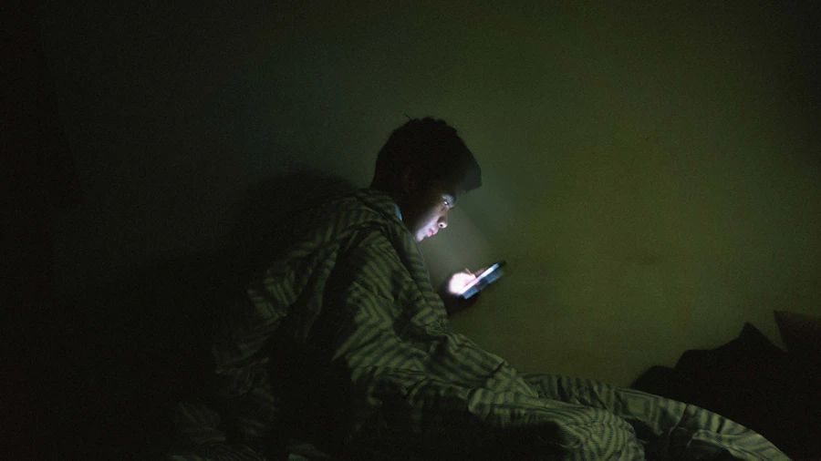 Person using a mobile phone in a cozy setting