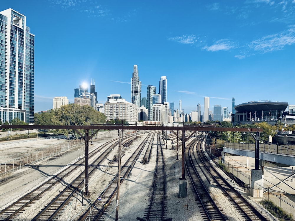 railways near high-rise buildings at daytime