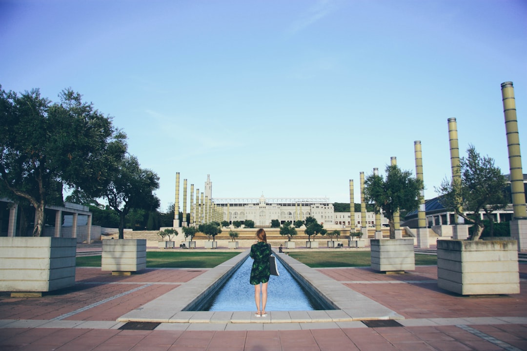 woman standing in front of swimming pool, Girl and Olympic village and pool