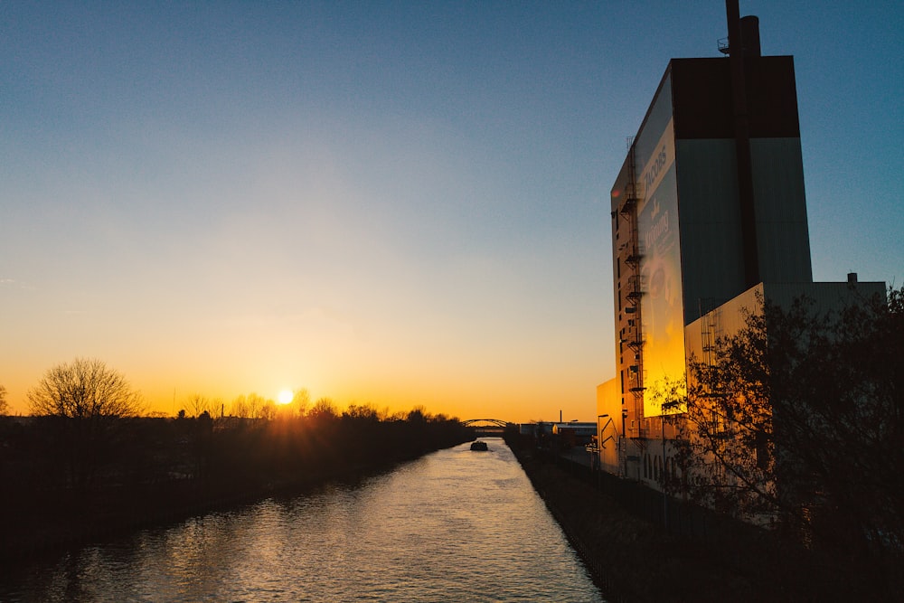 curtain wall building beside body of water